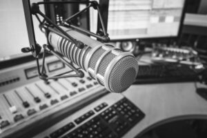 Professional microphone and audio mixer in radio studio